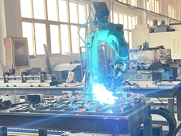 Robotic welding is in operation on the production line